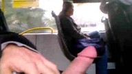 A guy is whipping his worm in the bus and cumming right here