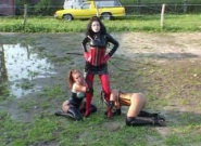 Rubber mistress dominates her lesbian latex slaves from